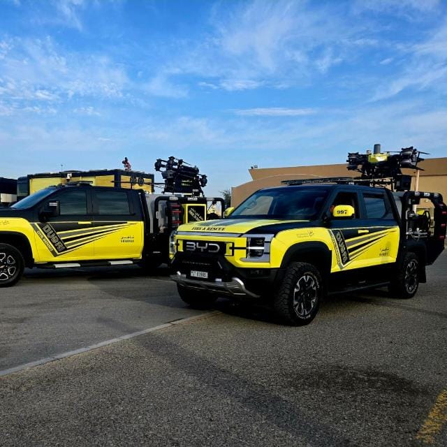 Dubai Civil Defence fleet of yellow BYD response trucks equipped with tethered firefighting drones